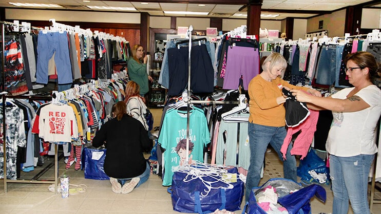 women_sorting_clothes